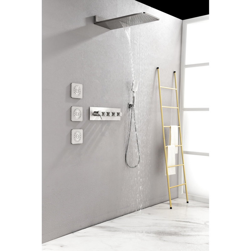 Système de douche mural en nickel brossé avec douchette et 3 jets corporels, fini nickel brossé.