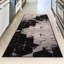 Tapis noir touffeté à motif géométrique Broschard-684190701