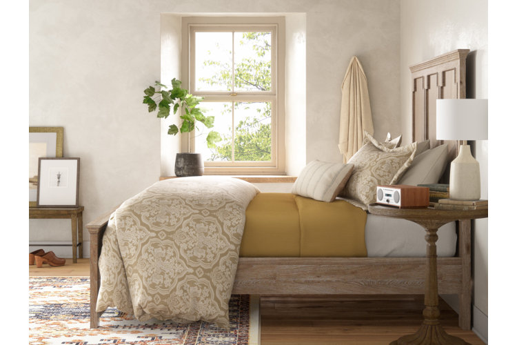 warm rustic bedroom with a wood panel bed