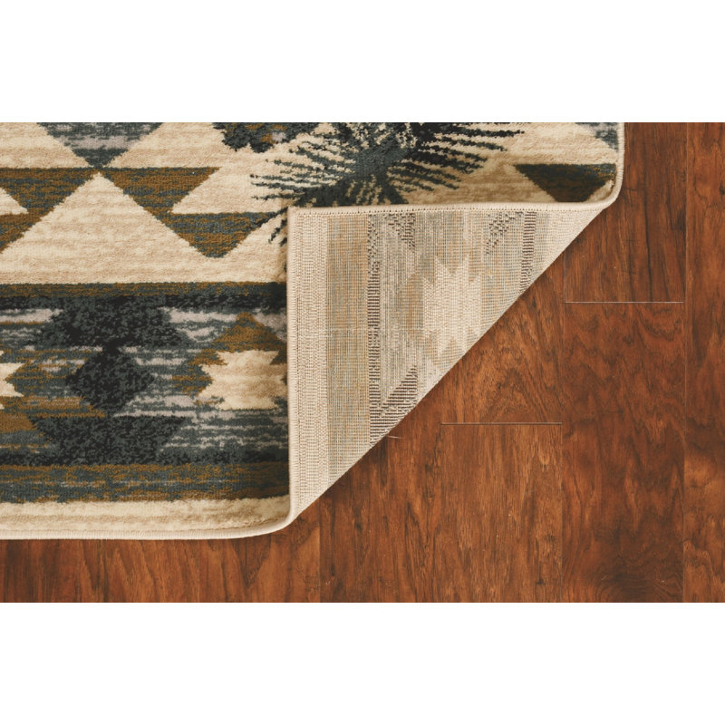 Tapis ivoire bleu géométrique tissé à la machine