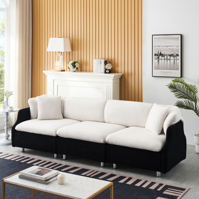 Spacieux 3 avec 2 coussins en velours noir et blanc pour un salon confortable en velours blanc, rehaussant le confort de l'ambiance