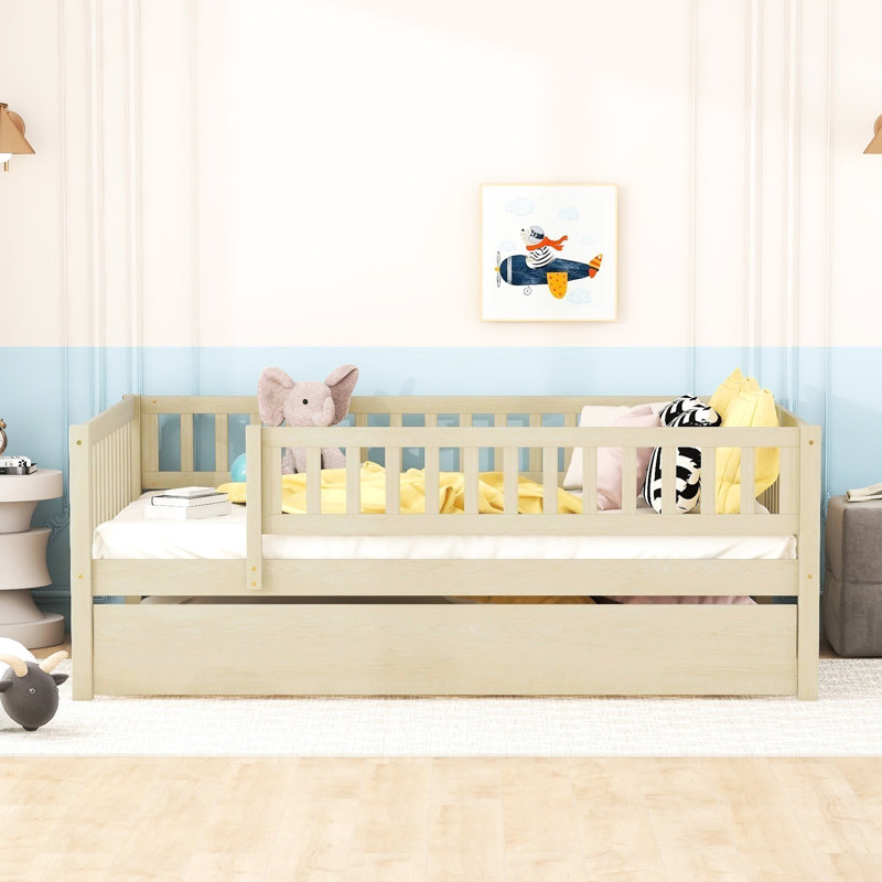 Full Size Daybed With Trundle And Secure Fence Guardrails In Natural Wood. Ensures A Restful Night. Space Optimization. No Box Spring Required Size Wood Guardrails. Improves Bedroom Practicality.