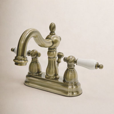 Kingston Brass Heritage Two-Handle 3-Hole Deck Mount 4" Centerset Bathroom Faucet with Plastic Pop-Up