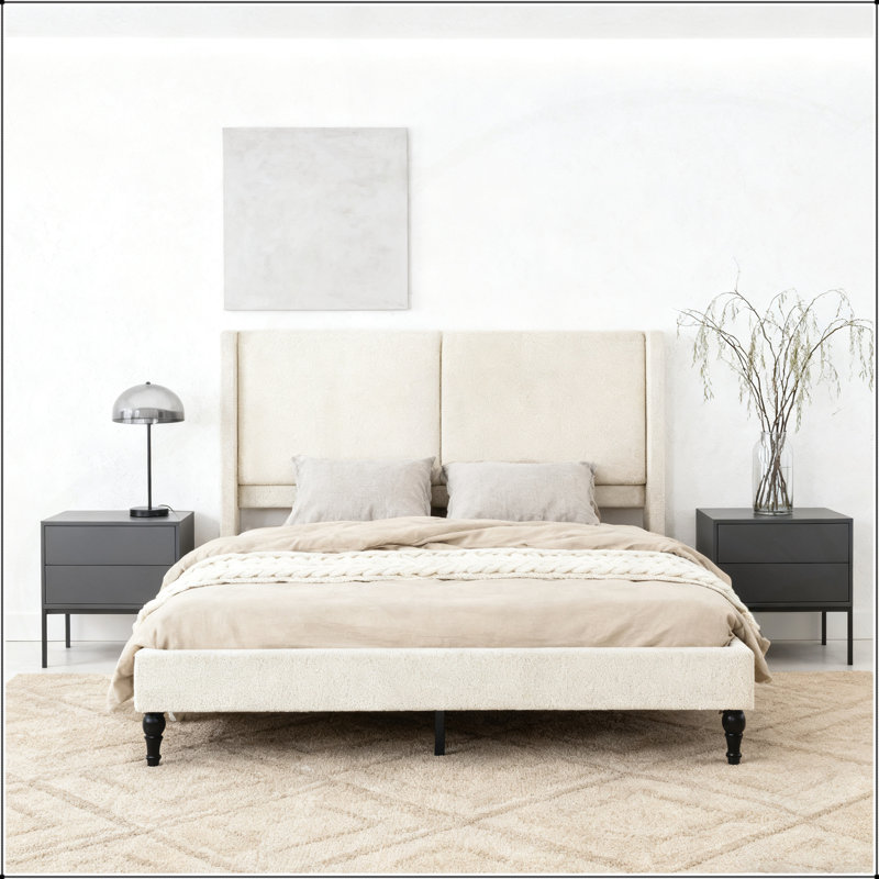 Luxueuse base de lit grand avec tête de lit capitonnée à dossier haut, tissu bouclé et pieds pour un confort et un style ultimes