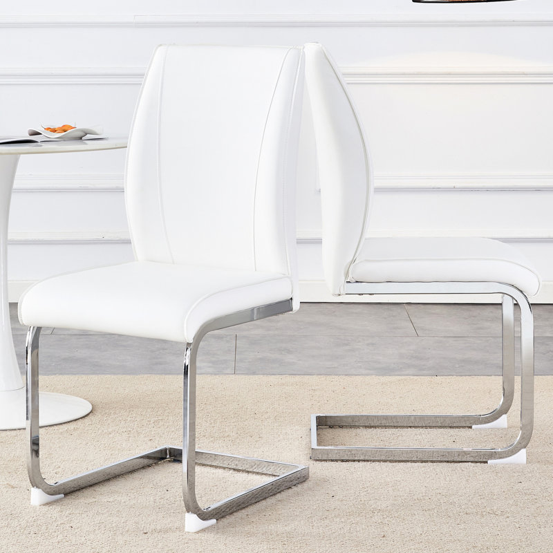 De 2 chaises de salle à manger blanches, d'unité centrale et d'un siège, de pieds arqués en métal et de 2 sièges de style moderne à structure stable - les pieds rehaussent la décoration intérieure