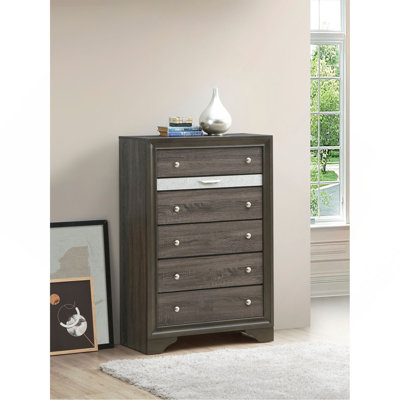 Commode verticale avec panneau décoratif et boutons ronds