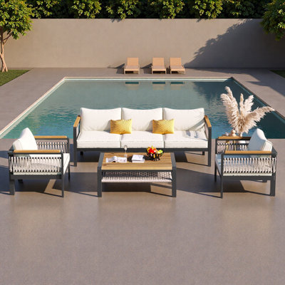 Ensemble de canapé modulaire d'extérieur 4 pièces pour 4 personnes avec ensemble de conversation avec coussins et table basse pour patio