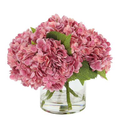 Arrangement floral d'hortensias dans un vase en verre Real Touch