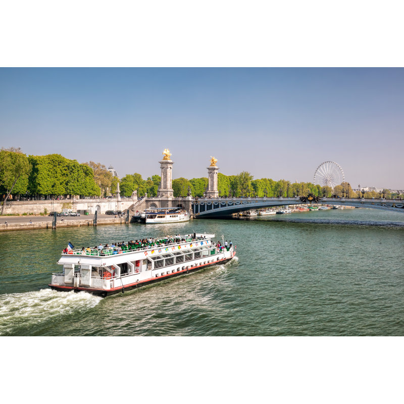 City Of Paris With Tourist Boat Close The Bridge On Seine River During Spring Time In Paris, France - Wrapped Canvas Print