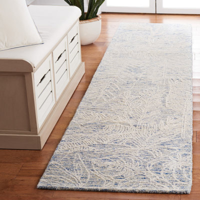 Tapis floral ivoire / bleu en laine / coton touffeté à la main Alezae