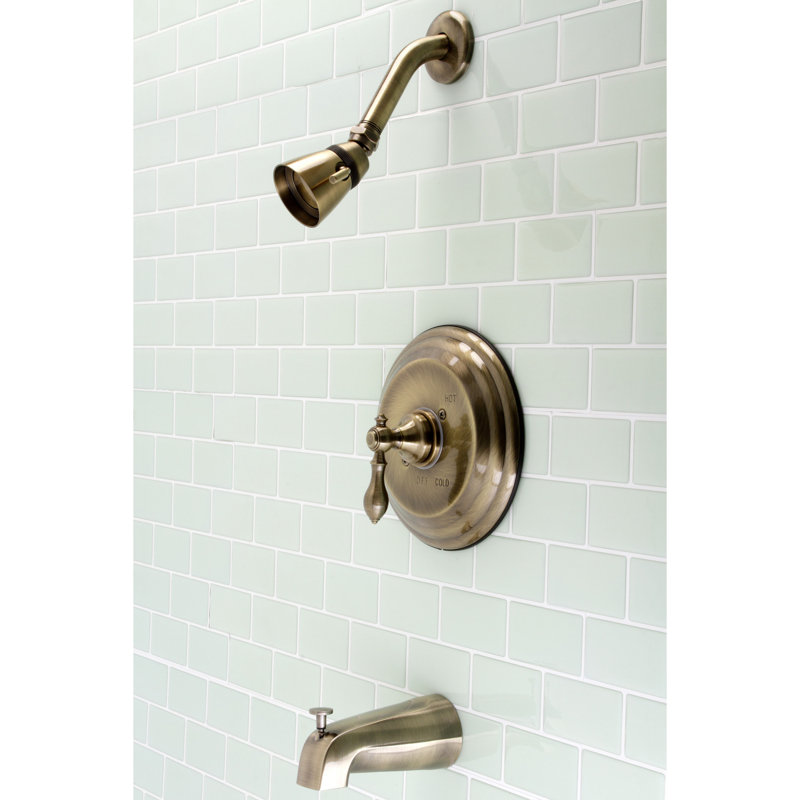 Robinet de baignoire et douche à pression équilibrée à poignée simple Kingston Brass, Laiton antique