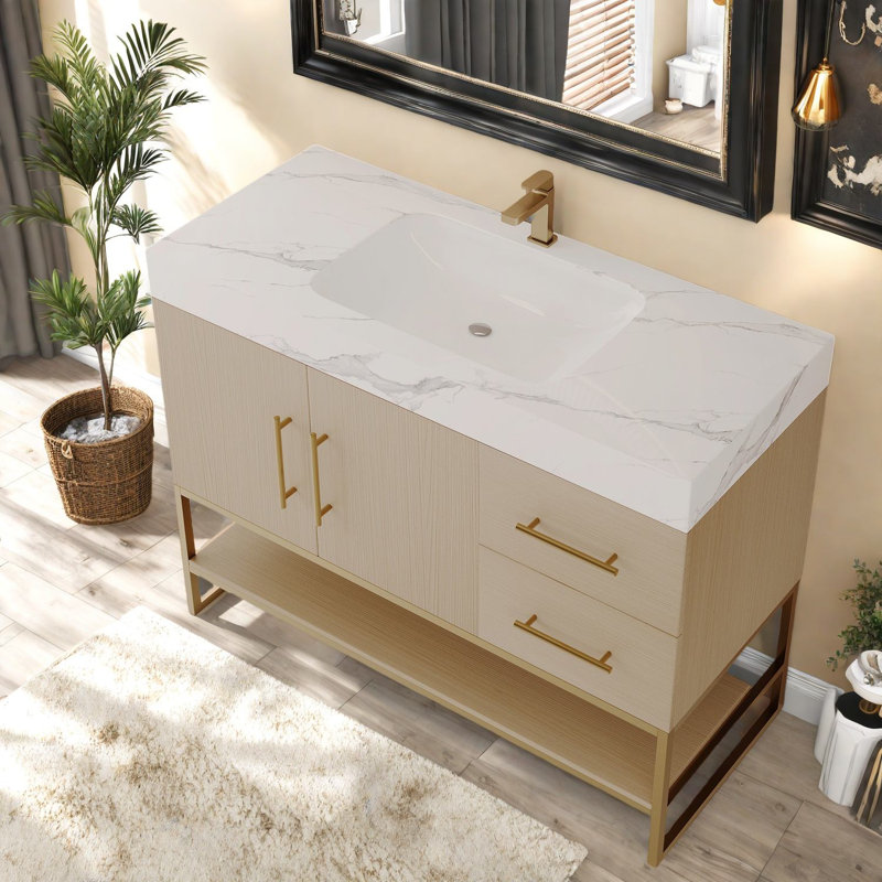 Meuble-lavabo moderne spacieux avec lavabo sans couture et accents dorés