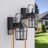 Abner 12.6''H Black Iron Clear Tempered Glass Outdoor Wall Light with Dusk to Dawn and Built-In GFCI Outlet