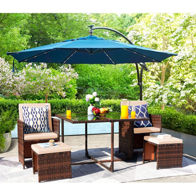 Fransje 4 - Person Wicker Patio Dining Set with Rectangular Table