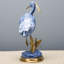 Figurine en porcelaine bleue avec aigrette et bronze