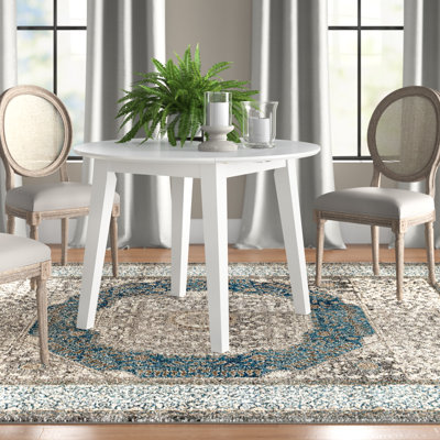 Iyad Extendable Round Solid Wood Dining Table