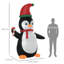 Pingouin tenant une canne de Noël gonflable