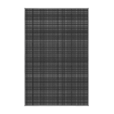 Tapis gris en laine à carreaux