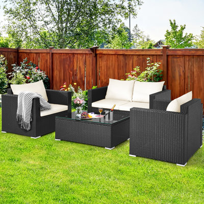 Bakerman Patio 4 Piece Rattan Sofa Seating Group with Cushions by Wade Logan