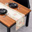 Chemin de table en dentelle crème avec découpes brodées de la collection Bryton pour une table de salle à manger ou un décor de Noël