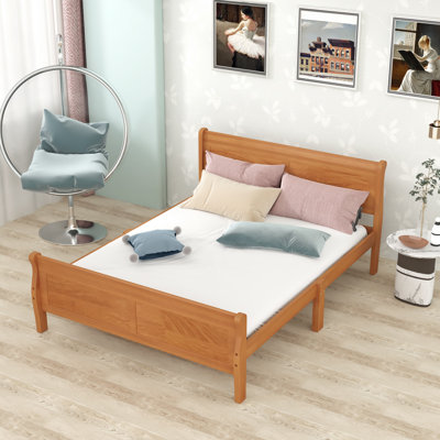 Lit plateforme en bois avec tête de lit