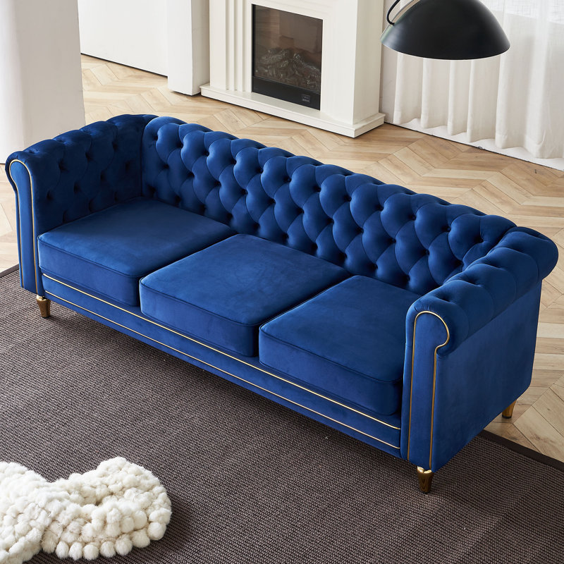 Canapé Chesterfield en velours à accoudoirs roulés Gevon, Bleu