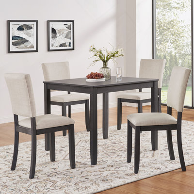 Ensemble de 4 chaises de salle à manger modernes et minimalistes avec siège rembourré en velours côtelé et structure en bois ergonomique pour une utilisation dans plusieurs pièces.