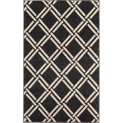 Tapis noir / beige à motif géométrique Soliana