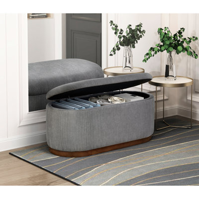 Banc de rangement chic en velours côtelé gris avec intérieur fonctionnel et élégant avec pieds en finition noyer