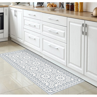 Abdiraxman Vinyl Machine Printed Area Rug