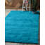Tapis turquoise Zuniga-559773637