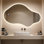 Miroir de salle de bain asymétrique à DEL rétroéclairé sans cadre avec réglage de 3 couleurs et antibuée