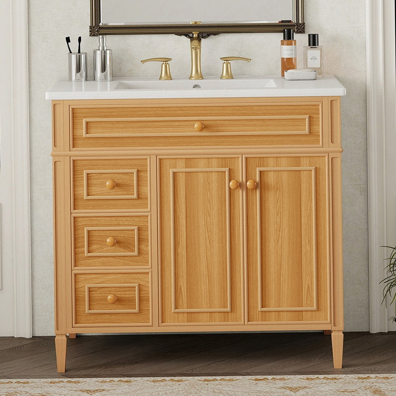 Meuble-lavabo de salle de bain avec lavabo, armoire en bois avec tiroir rabattable, plusieurs options de rangement, portes à fermeture en douceur et poignées élégantes pour les salles de bain modernes