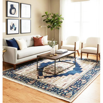 Tapis traditionnel à médaillon en laine ivoire et marine noué à la main