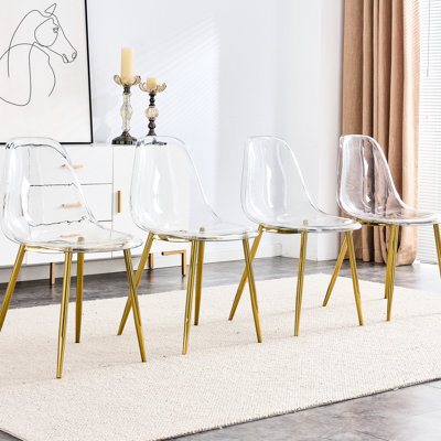 Chaise de salle à manger moderne et moderne - transparente avec pattes dorées et dossier à courbure légère