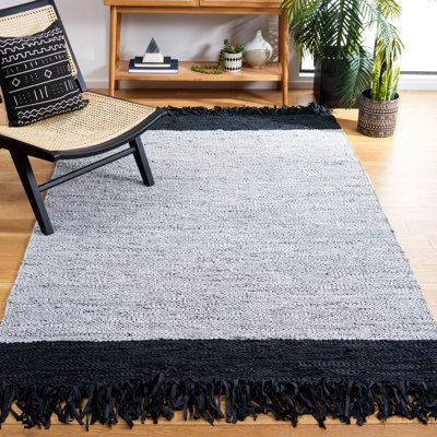 Tapis noir / ivoire en cuir tissé à la main Kostanca