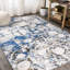 Tapis gris foncé / bleu à motif abstrait marbré Strausstown-1157955660