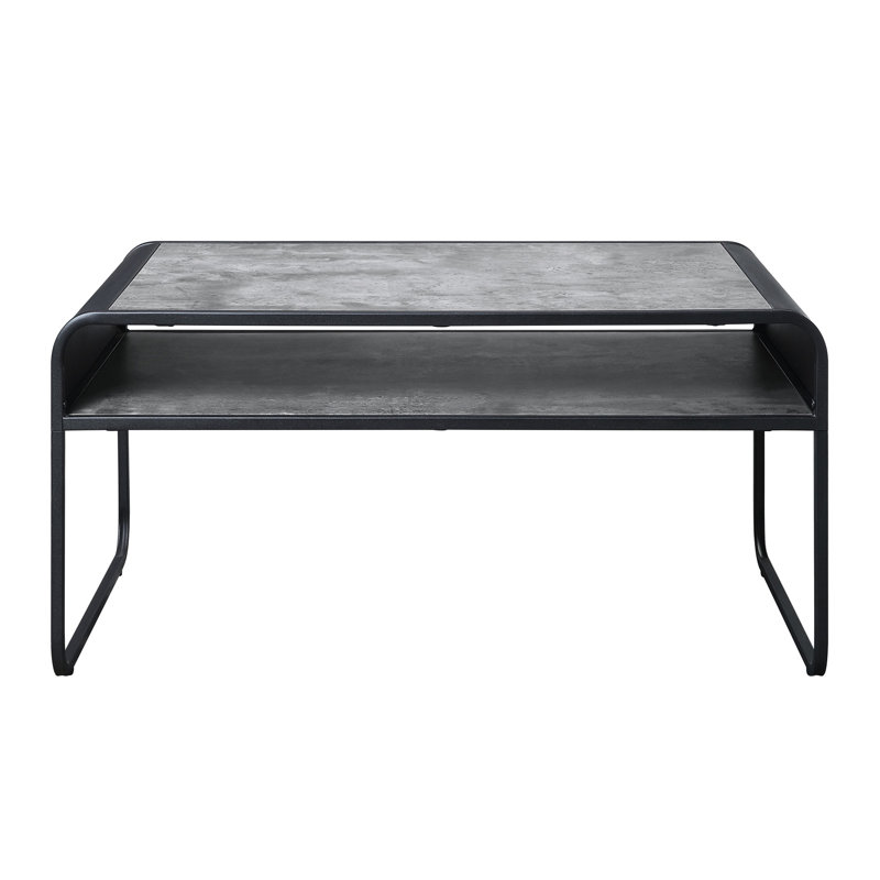 Table basse moderne en béton gris et noir avec tablette et base en métal pour le salon