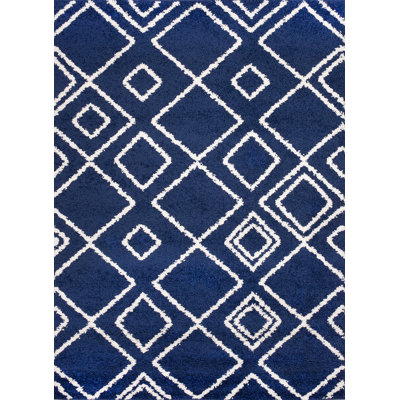 Tapis bleu à motif géométrique