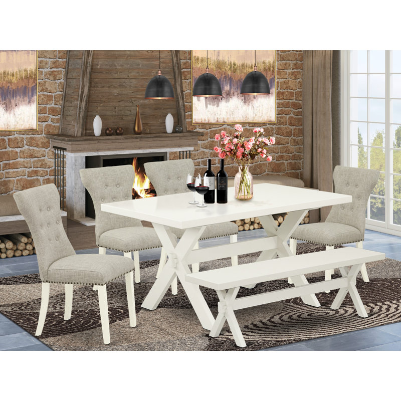 L'ensemble de table de salle à manger 6 pièces contient une table de cuisine rectangulaire avec des pieds en X et 4 chaises Parson en tissu de lin avec un banc, blanc lin
