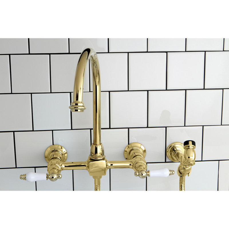 Kingston Brass Restoration Double-Handle 3-Hole Wall-Mount Bridge Kitchen Faucet with Brass Sprayer, Polished Brass/White
