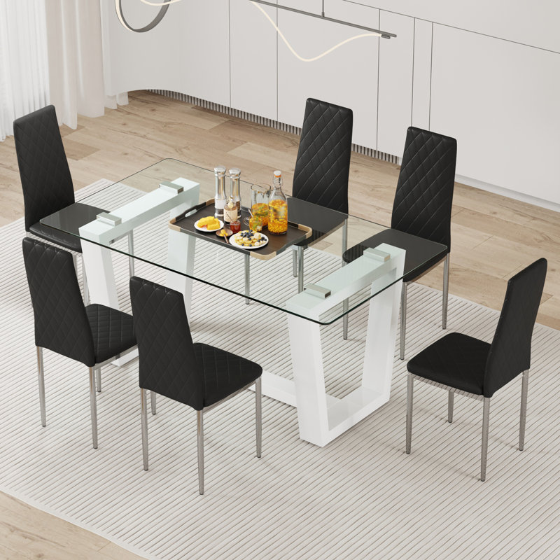 Ensemble de table et de chaises. Une table de salle à manger rectangulaire comprend un plateau en verre trempé et un support en panneau de fibres à densité moyenne blanc élégant.