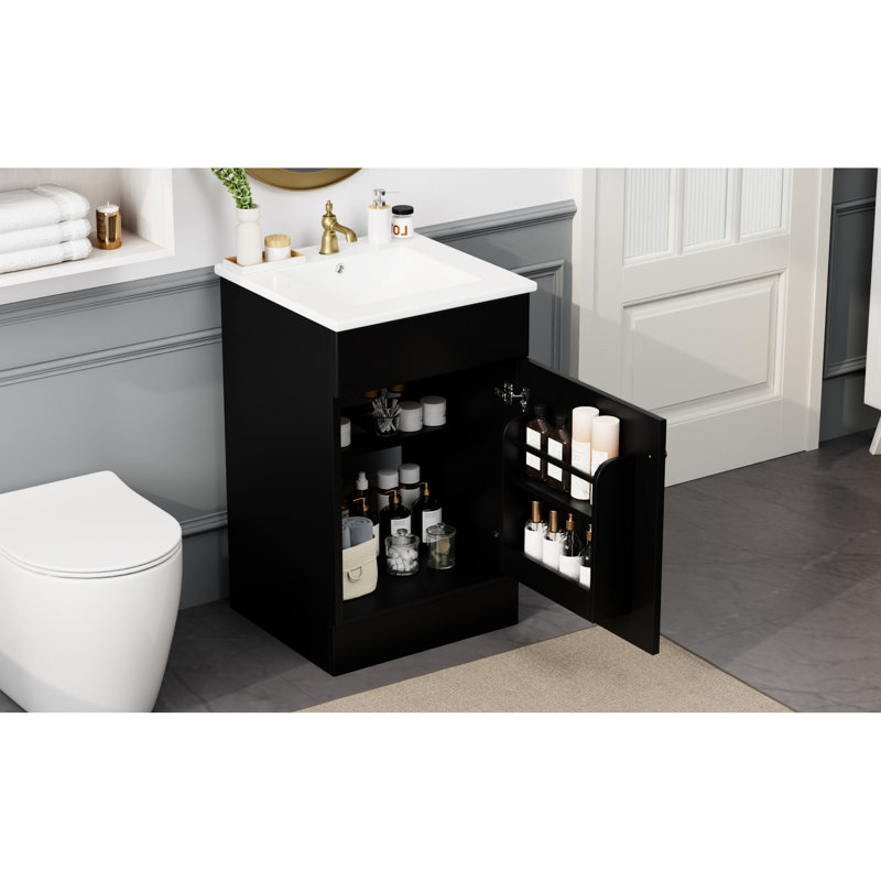 Meuble-lavabo noir de 20 po. Armoire avec lavabo en céramique. Couvercle de trop-plein lisse et cercle en métal. Tablette de porte et tablette réglable. Conception pratique du meuble-lavabo. Finition à l'eau.