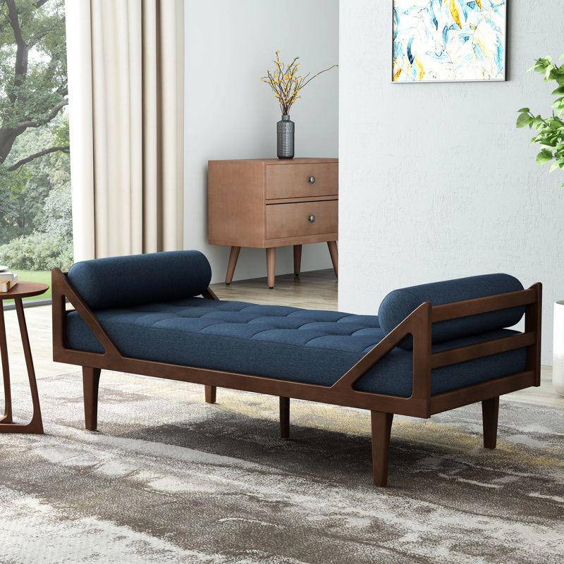 Chaise longue en tissu bleu marine: un endroit confortable pour se détendre avec un salon moderne avec une structure à boutons