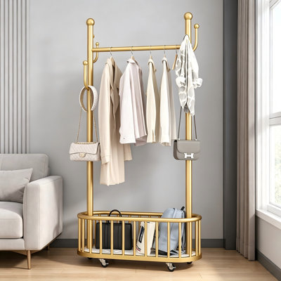 Portant à vêtements dorés de 174 cm de haut avec roulettes, tringle et crochets, porte-manteau en métal avec panier de rangement pour chambre et entrée