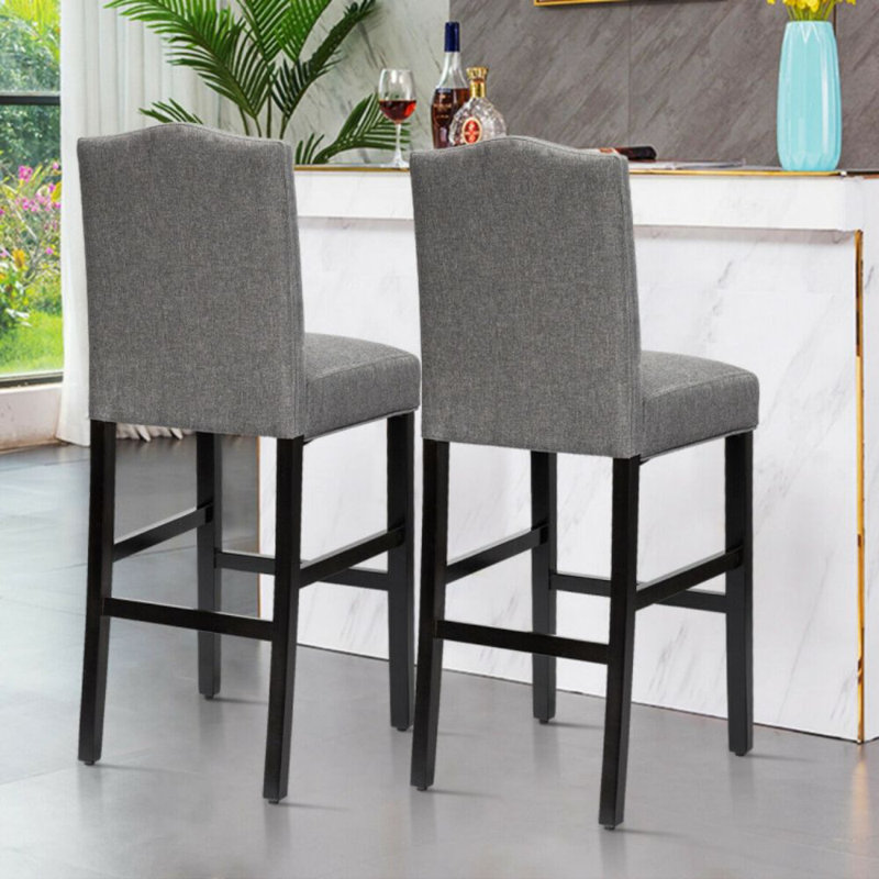 Gray Linen and Dark Wood Counter Height Barstools with Brass Nails