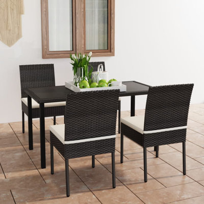 Aaila 4 - Person Patio Dining Set with Rectangular Table , Cushions Included