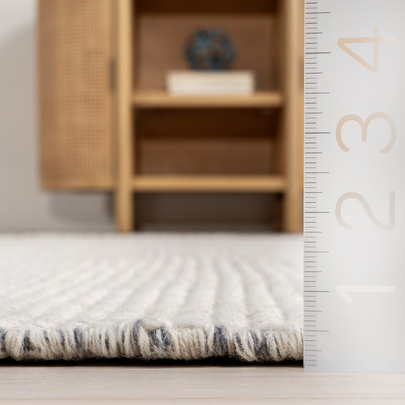 Handmade Ivory Wool Rectangular Area Rug with Fringe