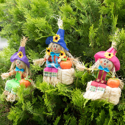 12" Sitting on Straw and Hay Bales Multicolor Trio Scarecrows for Halloween