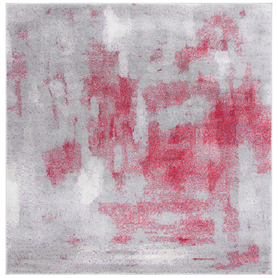 Tapis gris / rouge à motif abstrait